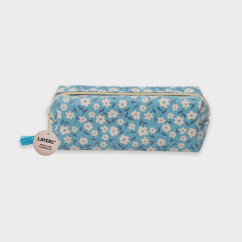 estuche azul flores blancas layers of